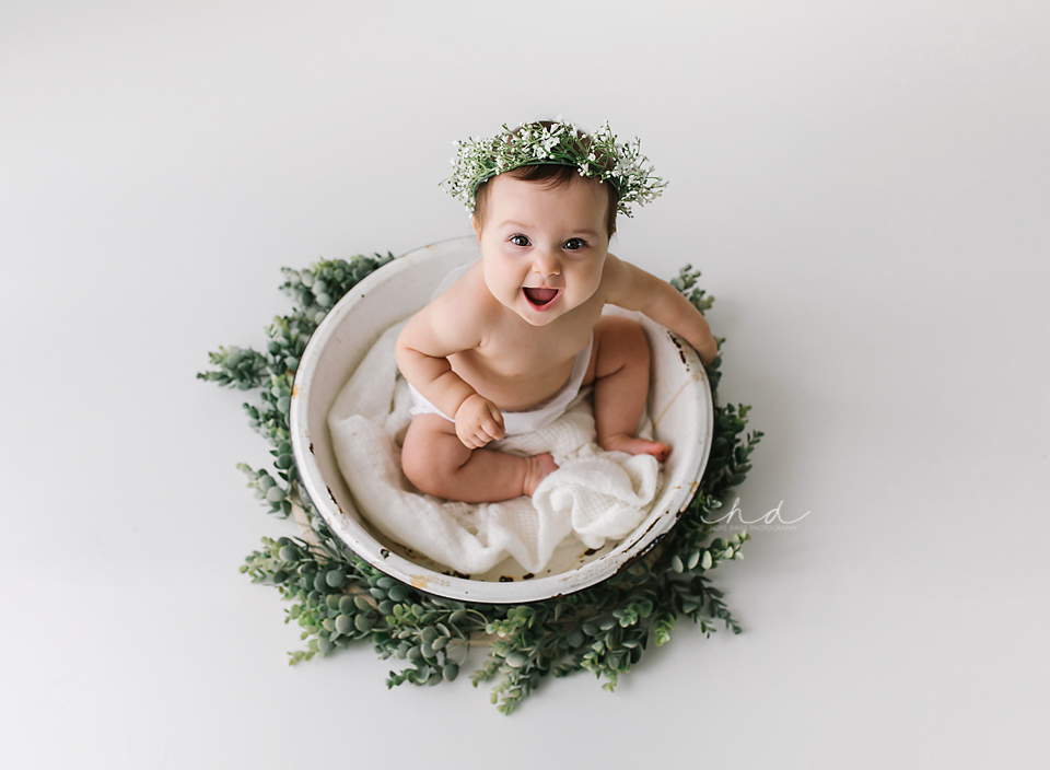 6 month old baby in washtub with floral crown