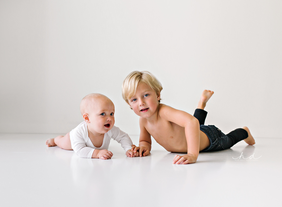Photo shoot white minimalist brother laying on floor