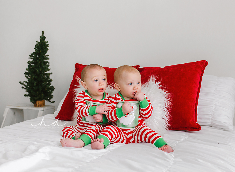 6 month old boy twins in Christmas pajamas photo shoot