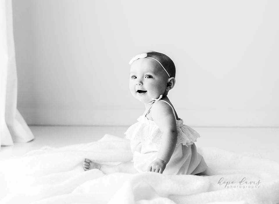 brandon ms baby photos baby girl sitting on blanket black and white picture