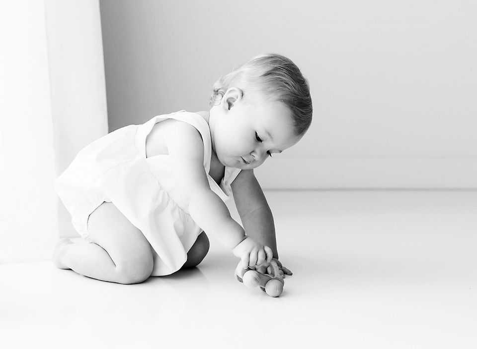jackson ms baby photographer baby boy playing with wooden car