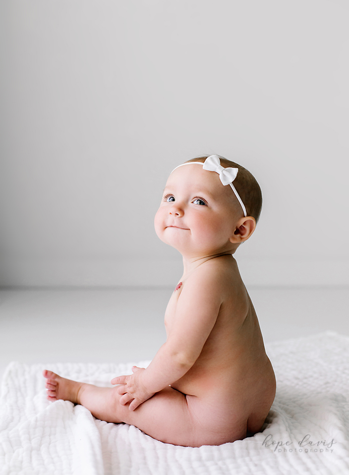 jackson ms baby photographer minimalist bare bottom on white blanket