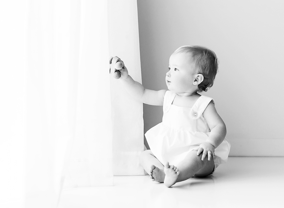jackson ms best baby photography boy plaing with wooden car black and white picture