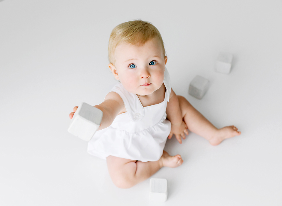 meridian ms child photography baby sitting on floor playing with blocks photo shoot