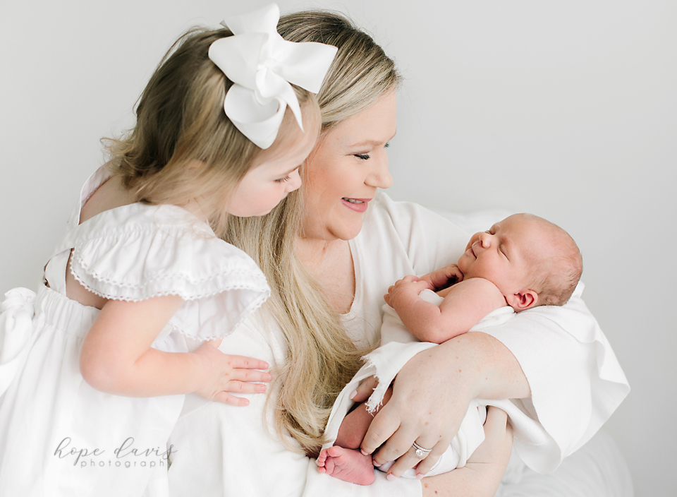 best newborn photographer in mississippi mom holding baby