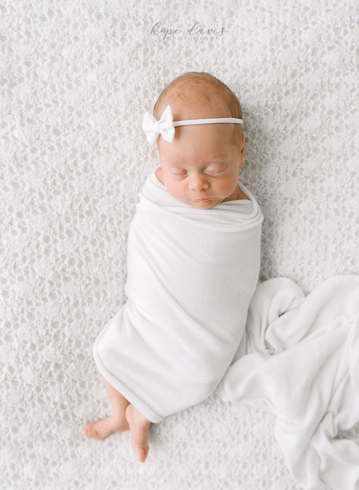 Mississippi newborn photograph of baby on white modern minimalist style.