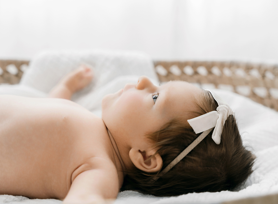 profile on baby in Moses basket