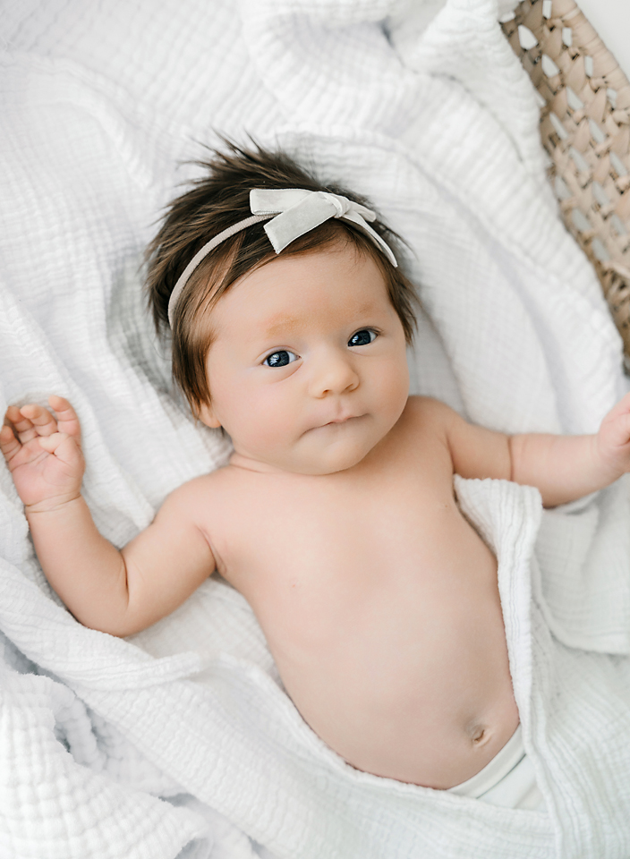 newborn baby in Moses basket