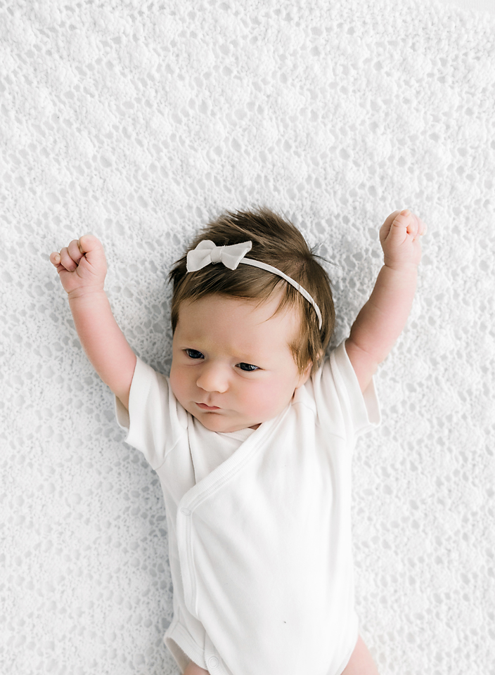 newborn on white blanket Mississippi photographer